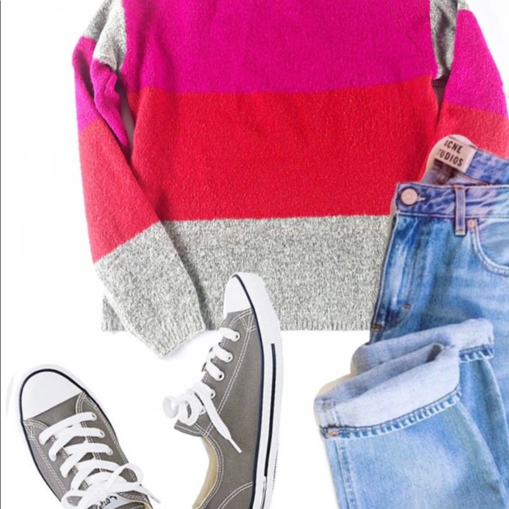 Cliche grey, pink and orange sweater.